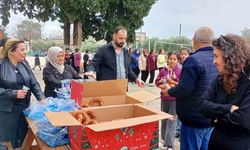 Kozan'da şehit aileleri ve gazilerden öğrencilere simit ikramı