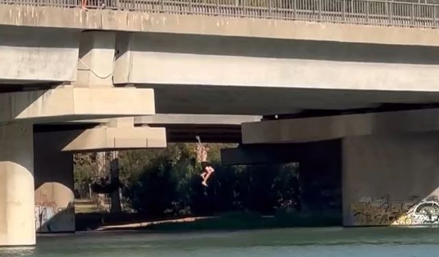 Serinlemek için metrelerce yükseklikten nehre atladılar