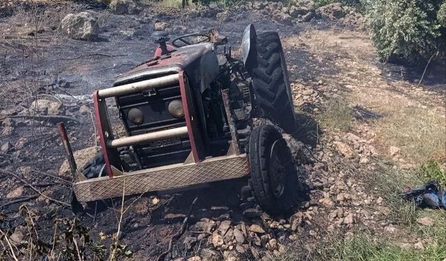 Erzin'de otluk alanda çıkan yangında alevler traktöre sıçradı